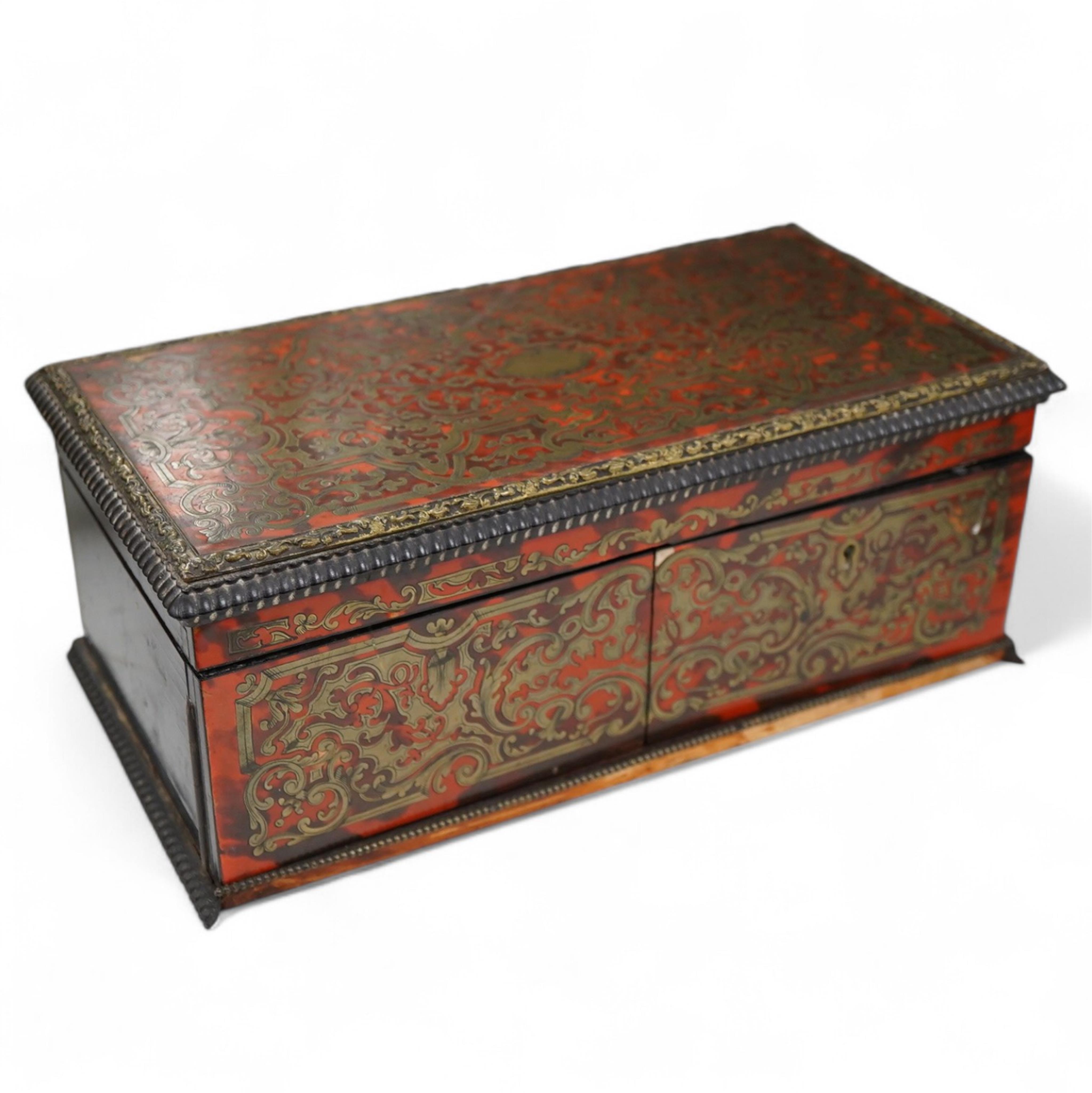 A 19th century French boullework glove box, signed Tahan, Rue de la Paix, width 27cm.